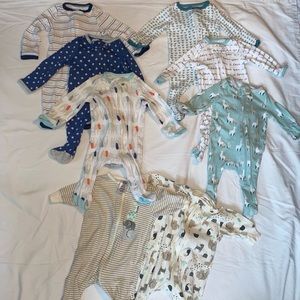 Lot of Newborn sized footie pajamas